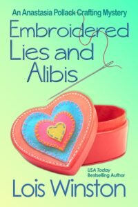 Embroidered Lies and Alibis by Lois Winston